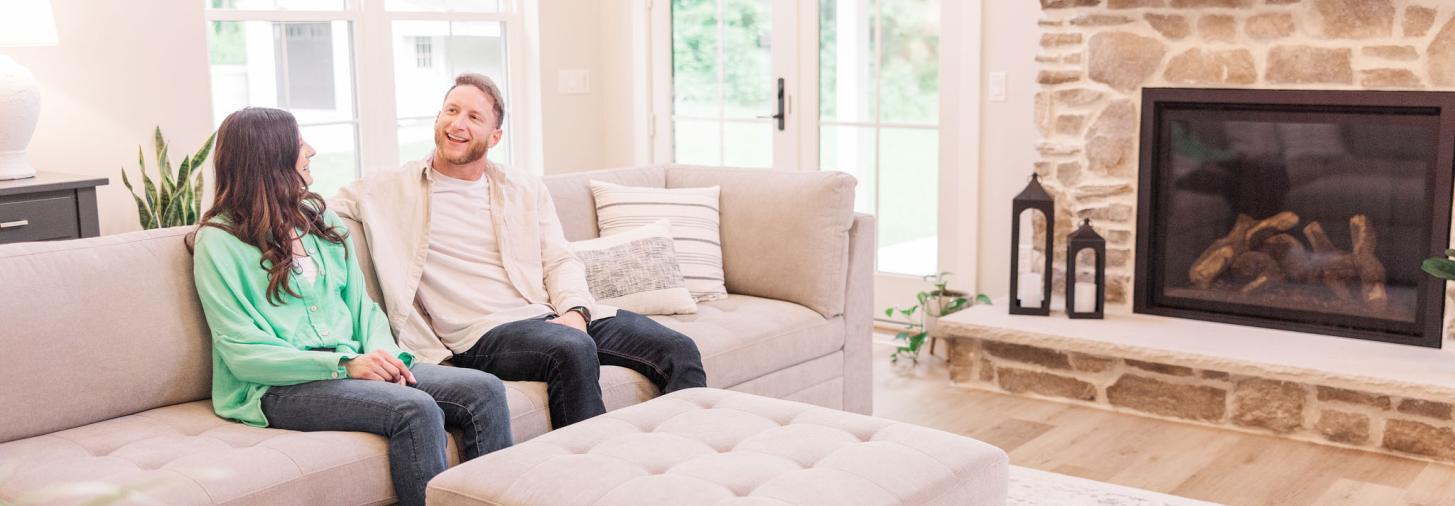 Young couple enjoying new living room