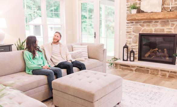 Young couple enjoying new living room